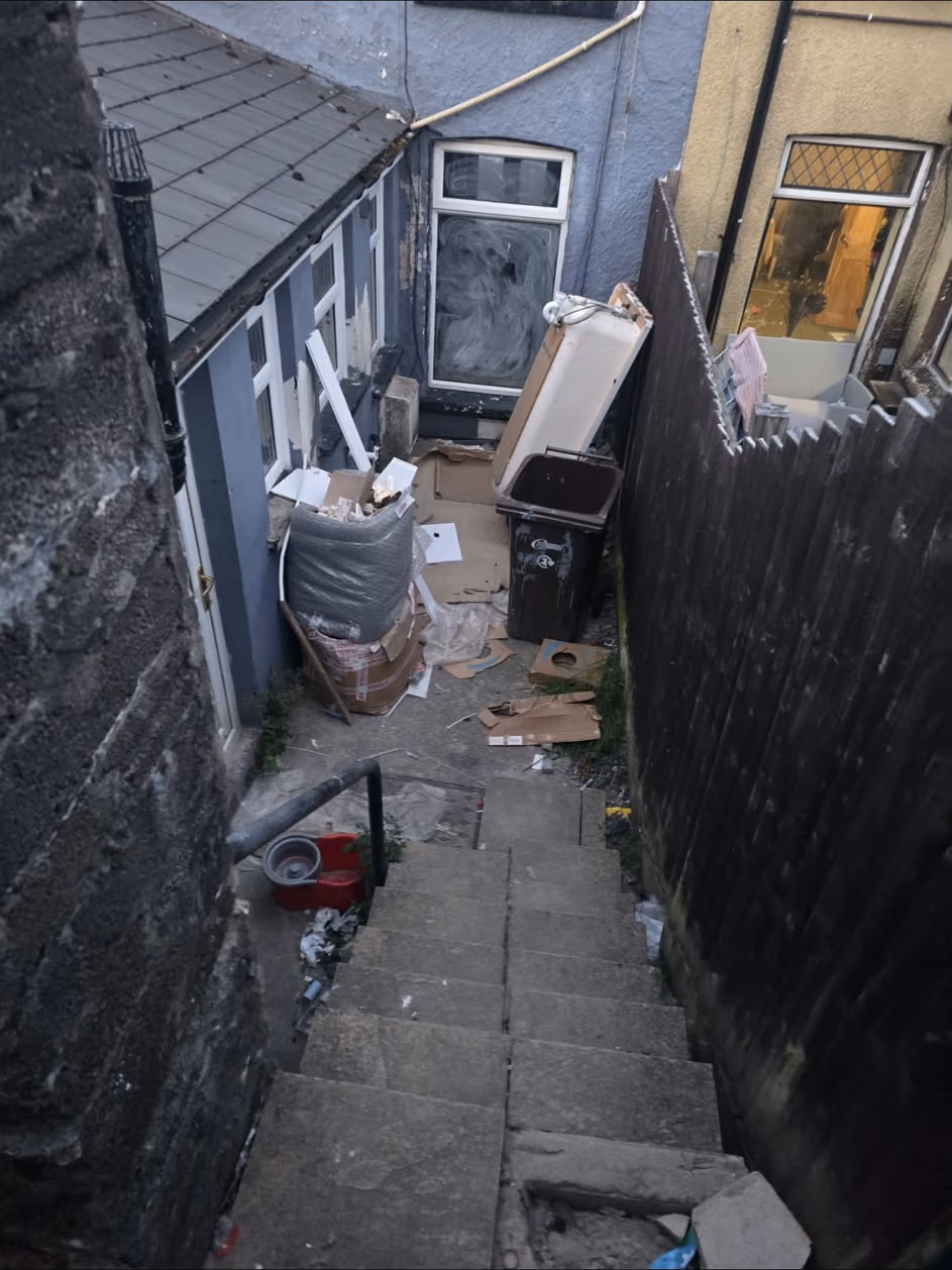 Before: rear yard cleared at a terraced house