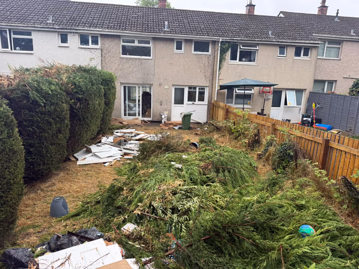 Before: green waste and garden rubbish cleared
