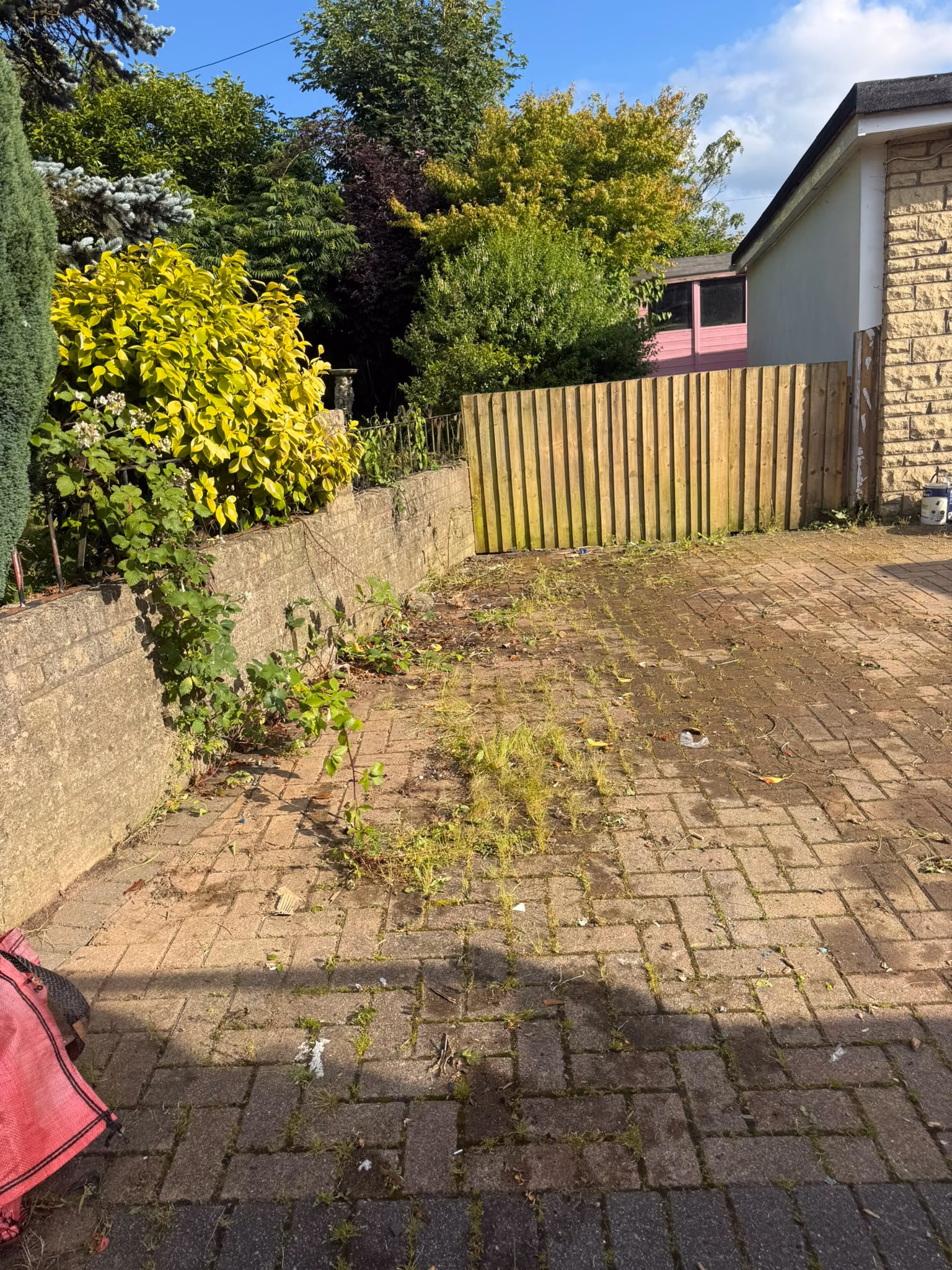 After: mixed rubbish and fencing cleared from a driveway